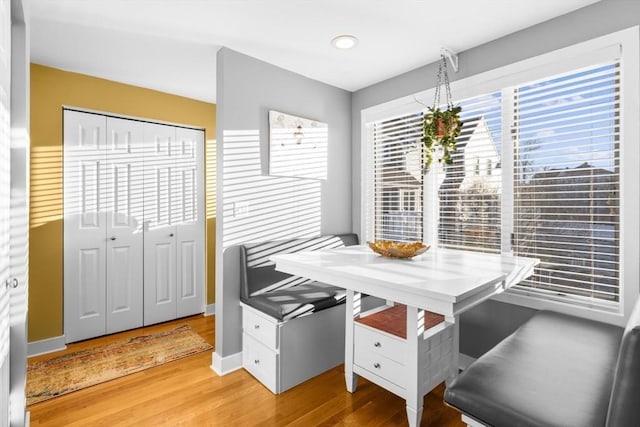 office featuring hardwood / wood-style flooring and breakfast area