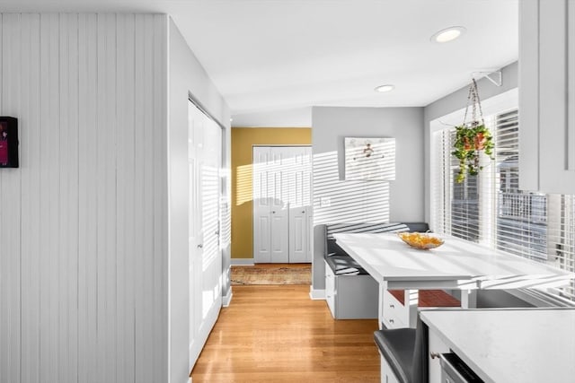 kitchen featuring white cabinets and light hardwood / wood-style floors