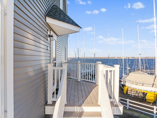 wooden deck featuring a water view