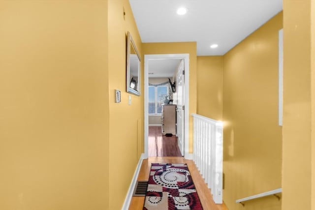 corridor featuring wood-type flooring