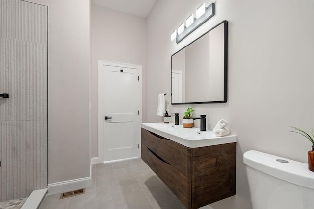 full bath with tile patterned flooring, toilet, a sink, visible vents, and double vanity