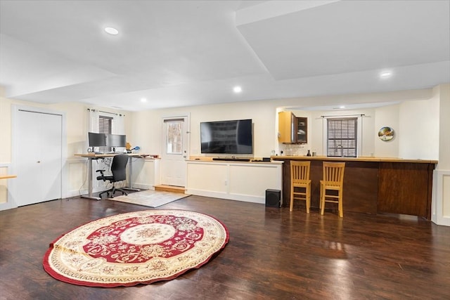 living area with recessed lighting and wood finished floors