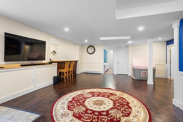 interior space with recessed lighting, baseboards, wood finished floors, and baseboard heating
