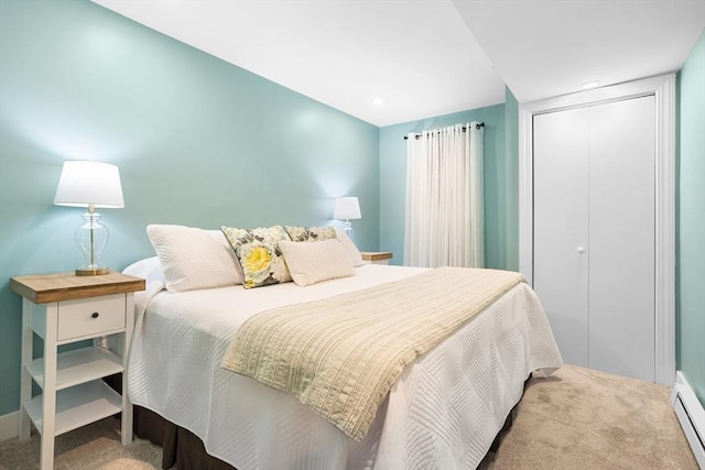 carpeted bedroom with baseboards and a closet
