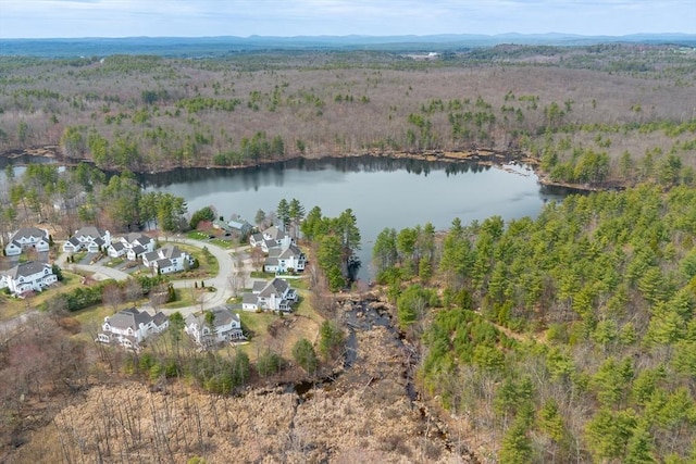 birds eye view of property with a water view, a residential view, and a wooded view