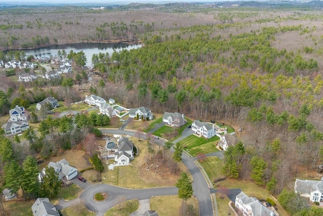 aerial view featuring a residential view, a water view, and a forest view