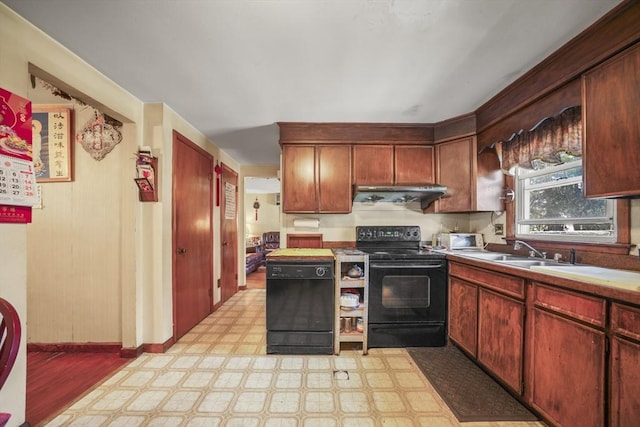 161 Columba St, Chicopee, MA 01020 - kitchen featuring black appliances, light flooring, under cabinet range hood, and light countertops