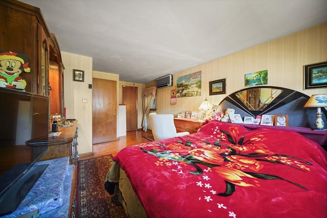 161 Columba St, Chicopee, MA 01020 - bedroom featuring wood finished floors, a wall mounted AC, and wallpapered walls