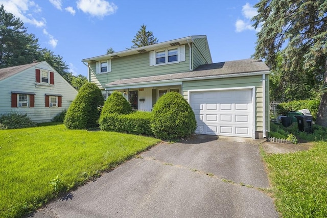 161 Columba St, Chicopee, MA 01020 - traditional-style home with asphalt driveway, an attached garage, and a front yard