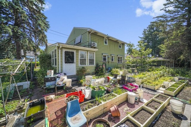 161 Columba St, Chicopee, MA 01020 - rear view of house featuring a garden
