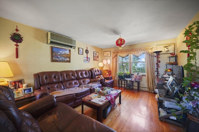 161 Columba St, Chicopee, MA 01020 - living room with an AC wall unit and wood finished floors