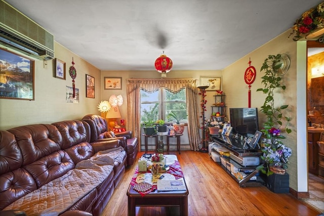 161 Columba St, Chicopee, MA 01020 - living room with wood finished floors and a baseboard heating unit