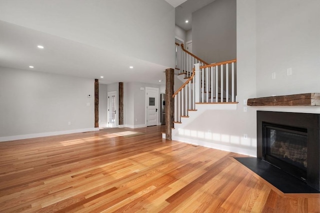 unfurnished living room featuring light hardwood / wood-style floors