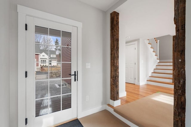 entryway with hardwood / wood-style floors