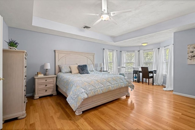 10 Gianna Dr, Saugus, MA 01906 - bedroom featuring a raised ceiling, light wood-type flooring, and ceiling fan
