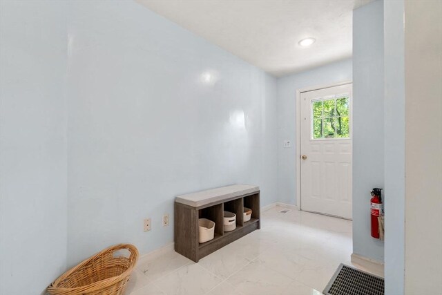 10 Gianna Dr, Saugus, MA 01906 - doorway to outside with light marble finish floors and baseboards