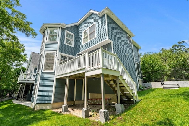 10 Gianna Dr, Saugus, MA 01906 - rear view of property featuring a wooden deck, a lawn, and stairs