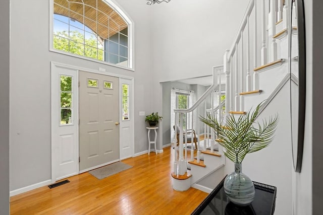 10 Gianna Dr, Saugus, MA 01906 - foyer entrance featuring stairway, light wood finished floors, and a towering ceiling