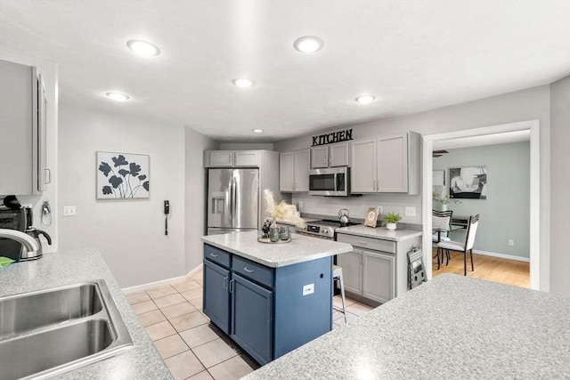 10 Gianna Dr, Saugus, MA 01906 - kitchen featuring stainless steel appliances, light countertops, recessed lighting, light tile patterned floors, and a center island