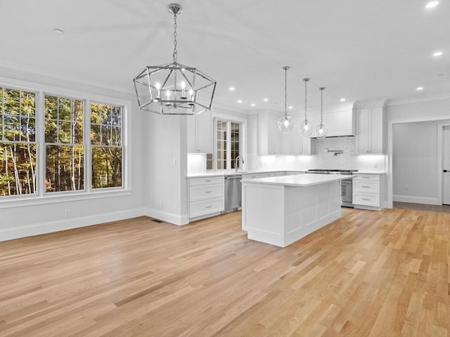 35 Lincoln St, Hopkinton, MA 01748 - kitchen featuring dishwasher, light countertops, backsplash, white cabinets, and a chandelier