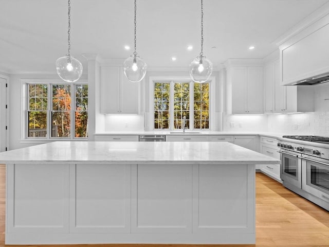 35 Lincoln St, Hopkinton, MA 01748 - kitchen featuring appliances with stainless steel finishes, white cabinetry, decorative backsplash, plenty of natural light, and recessed lighting
