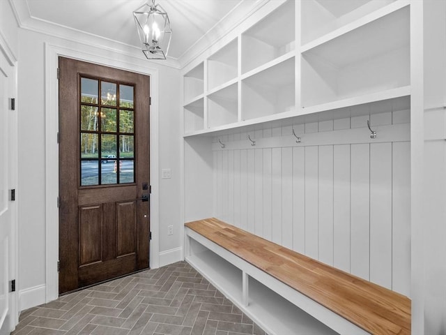 35 Lincoln St, Hopkinton, MA 01748 - mudroom with brick floors, a chandelier, and crown molding