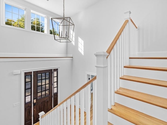 35 Lincoln St, Hopkinton, MA 01748 - stairs featuring a chandelier and a towering ceiling