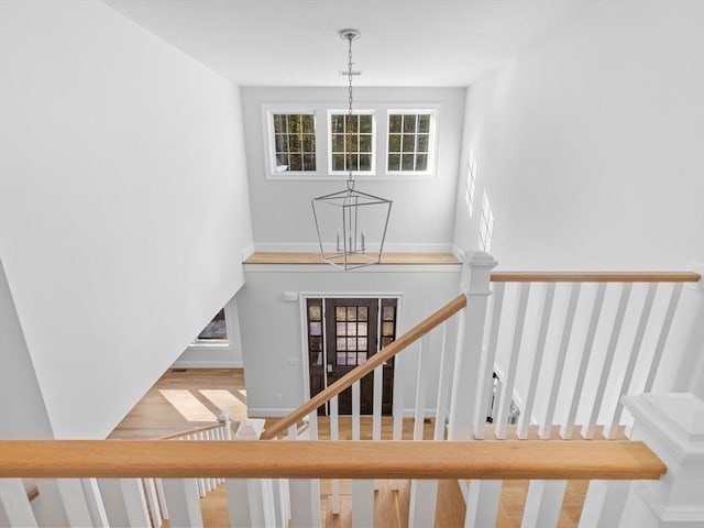 35 Lincoln St, Hopkinton, MA 01748 - staircase featuring a chandelier and wood finished floors