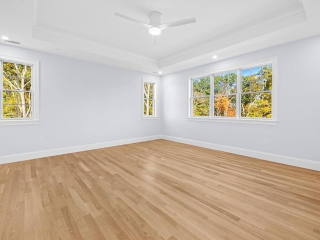 35 Lincoln St, Hopkinton, MA 01748 - empty room featuring a tray ceiling, ornamental molding, light wood finished floors, ceiling fan, and recessed lighting