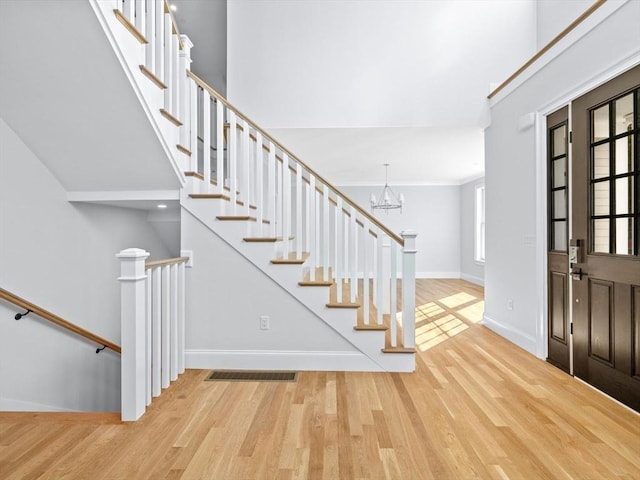 35 Lincoln St, Hopkinton, MA 01748 - foyer entrance with wood finished floors and a chandelier