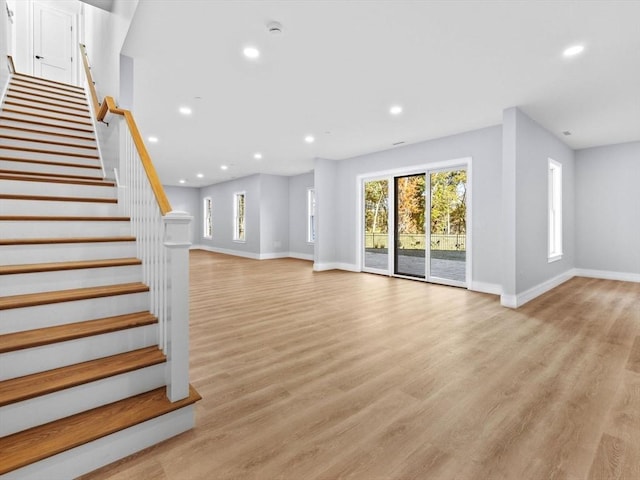 35 Lincoln St, Hopkinton, MA 01748 - unfurnished living room featuring recessed lighting, light wood-style flooring, and stairway