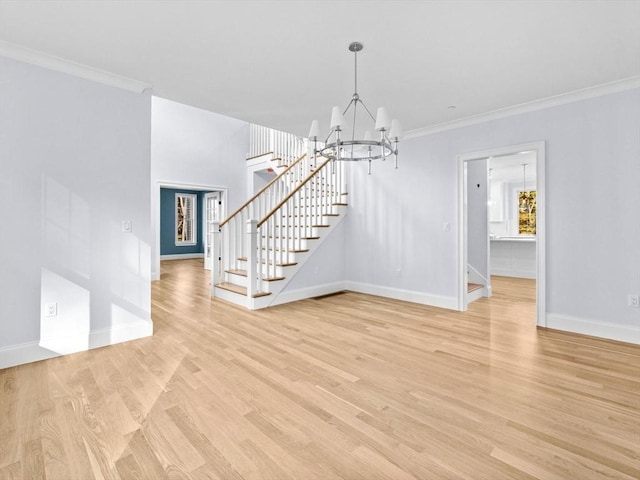 35 Lincoln St, Hopkinton, MA 01748 - unfurnished living room featuring a chandelier, stairway, ornamental molding, and light wood-style floors