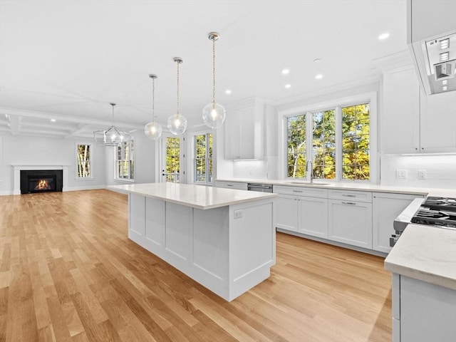 35 Lincoln St, Hopkinton, MA 01748 - kitchen with light wood finished floors, a center island, healthy amount of natural light, recessed lighting, and white cabinetry