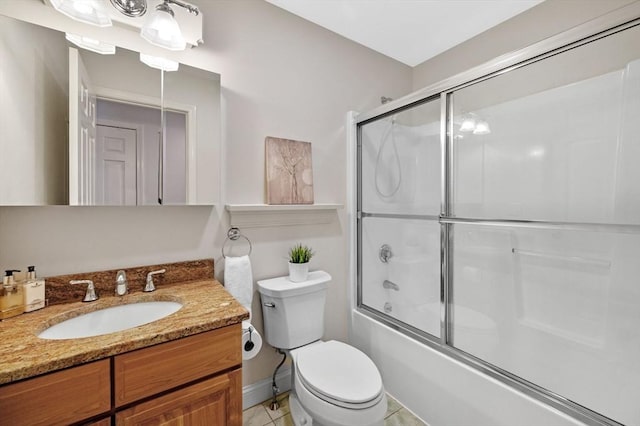 full bathroom with tile patterned floors, enclosed tub / shower combo, toilet, and vanity