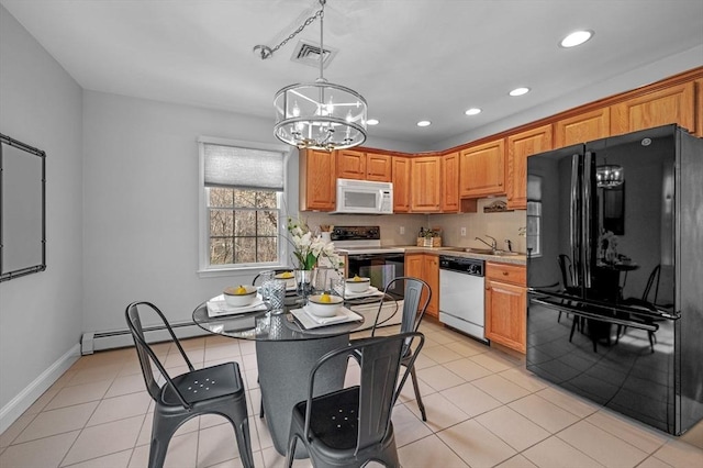 kitchen with visible vents, black appliances, light countertops, light tile patterned floors, and a baseboard radiator