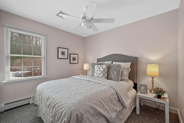 bedroom featuring a baseboard heating unit, carpet floors, baseboards, and ceiling fan