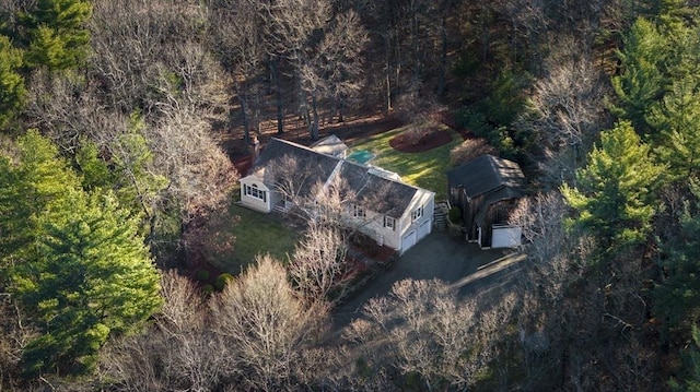 drone / aerial view featuring a forest view