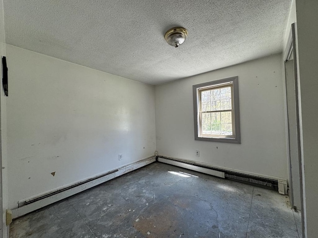 empty room featuring concrete flooring and a textured ceiling