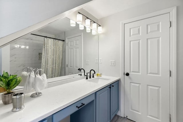 bathroom featuring a shower with curtain and vanity