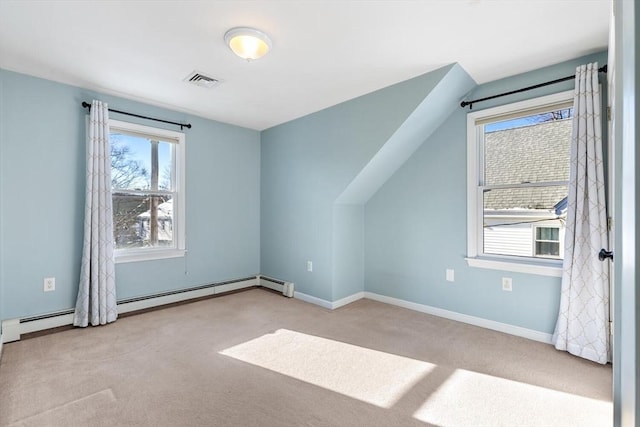 additional living space with light carpet, a baseboard heating unit, and lofted ceiling