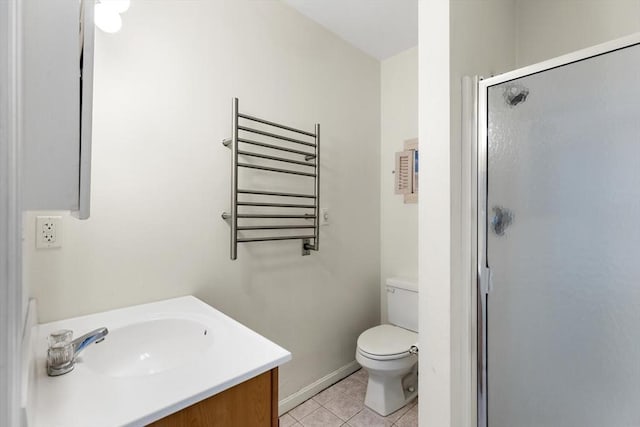 bathroom featuring radiator, a shower with door, vanity, tile patterned floors, and toilet