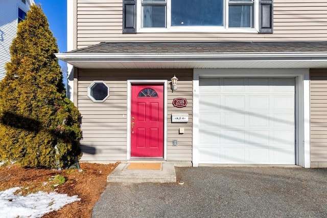 entrance to property featuring a garage