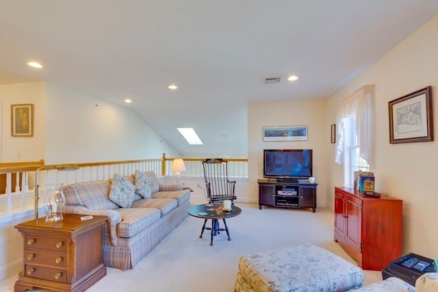 living room with visible vents, recessed lighting, a skylight, and carpet floors