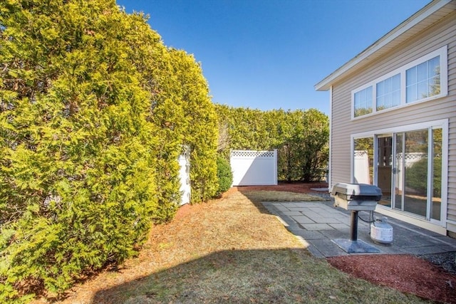 view of yard featuring a patio area and fence