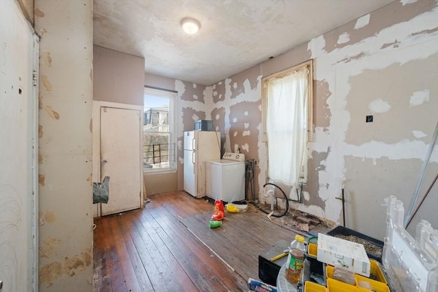 interior space featuring washer / clothes dryer and hardwood / wood-style flooring