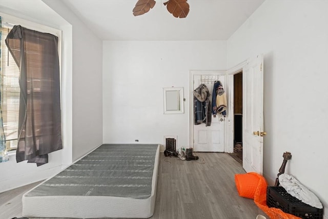 bedroom with ceiling fan and wood finished floors