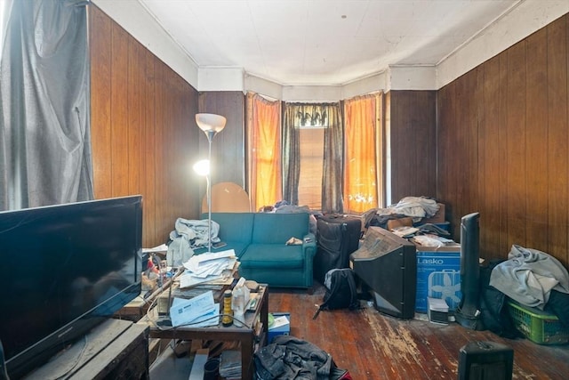 living area featuring wood walls and hardwood / wood-style flooring