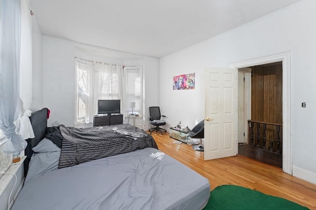 bedroom featuring wood finished floors