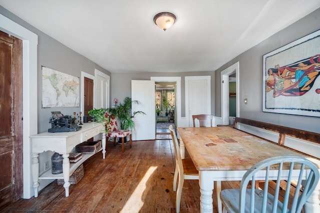 dining space featuring dark hardwood / wood-style floors