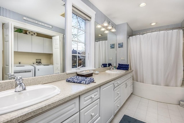 bathroom with washing machine and dryer, tile patterned flooring, vanity, and shower / tub combo